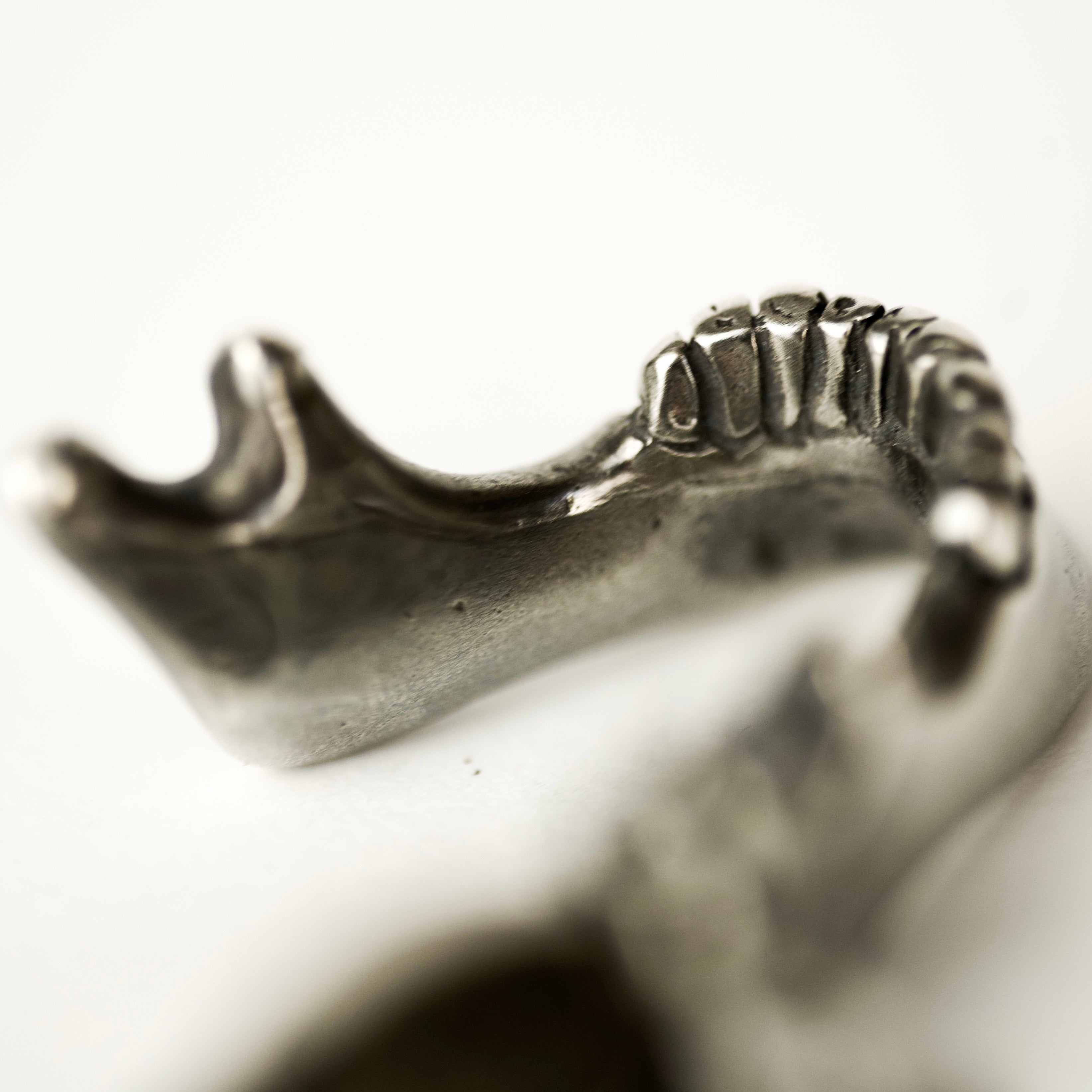 Silver Skull Jaw pendant handcrafted by Macabre Gadgets - close up on the miniature handcrafted skull jaw details