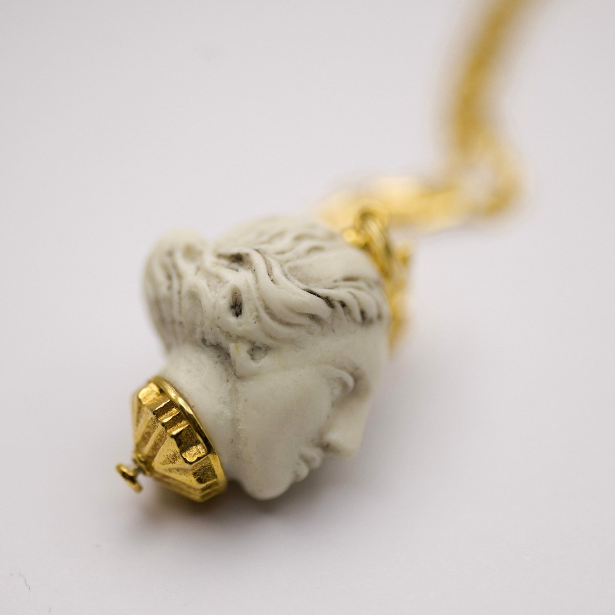 Artemis pendant - mythology inspired marble charm with gold detail on neutral background