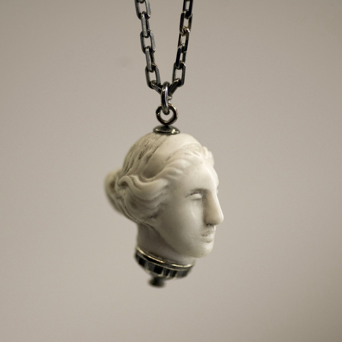Artemis pendant - silver variant - dainty charm featuring goddess Diana's head with silver decoration.