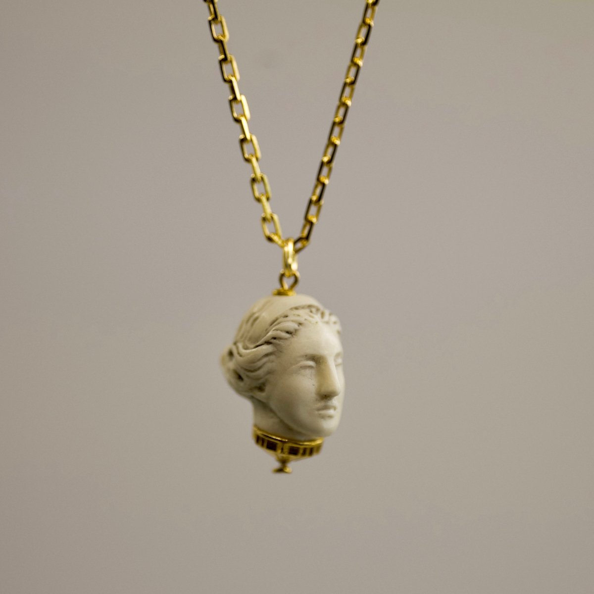Artemis pendant - gold variant - dainty marble charm in shape of goddess head on gold-plated anchor chain