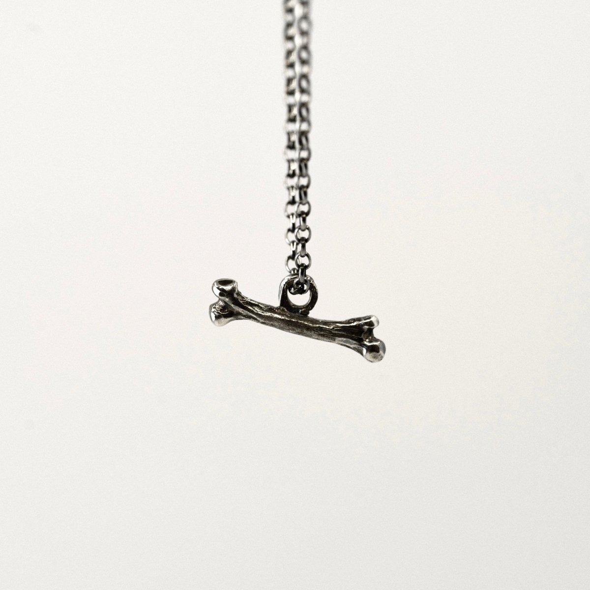 Tiny one pendant - string silver small textured bone charm on dainty chain