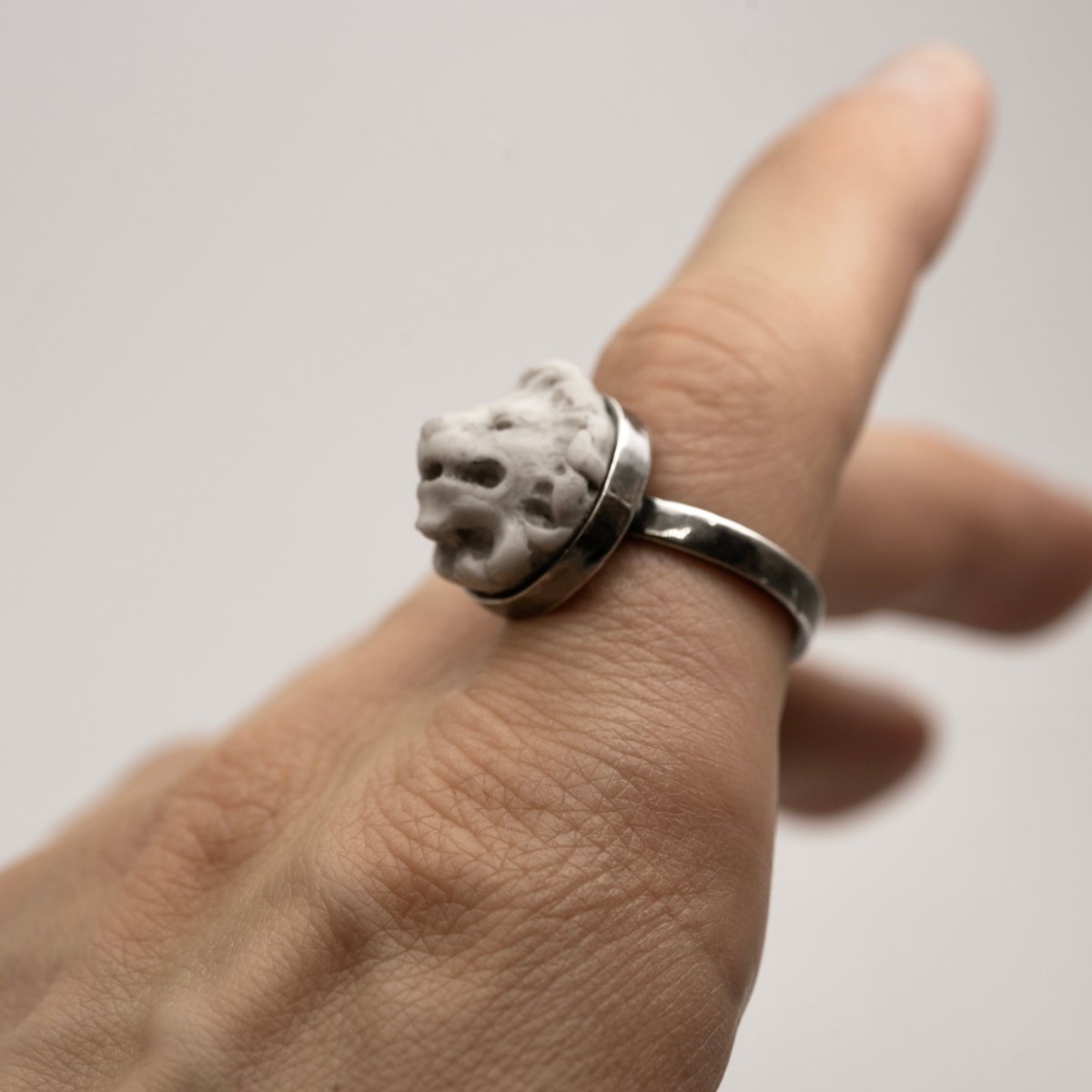 Model wearing a Lion ring - cameo like marble lion set in silver - classical men's ring styling shot