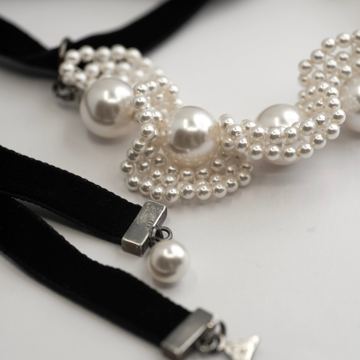 dainty pearl bracelet - close up on a white surface