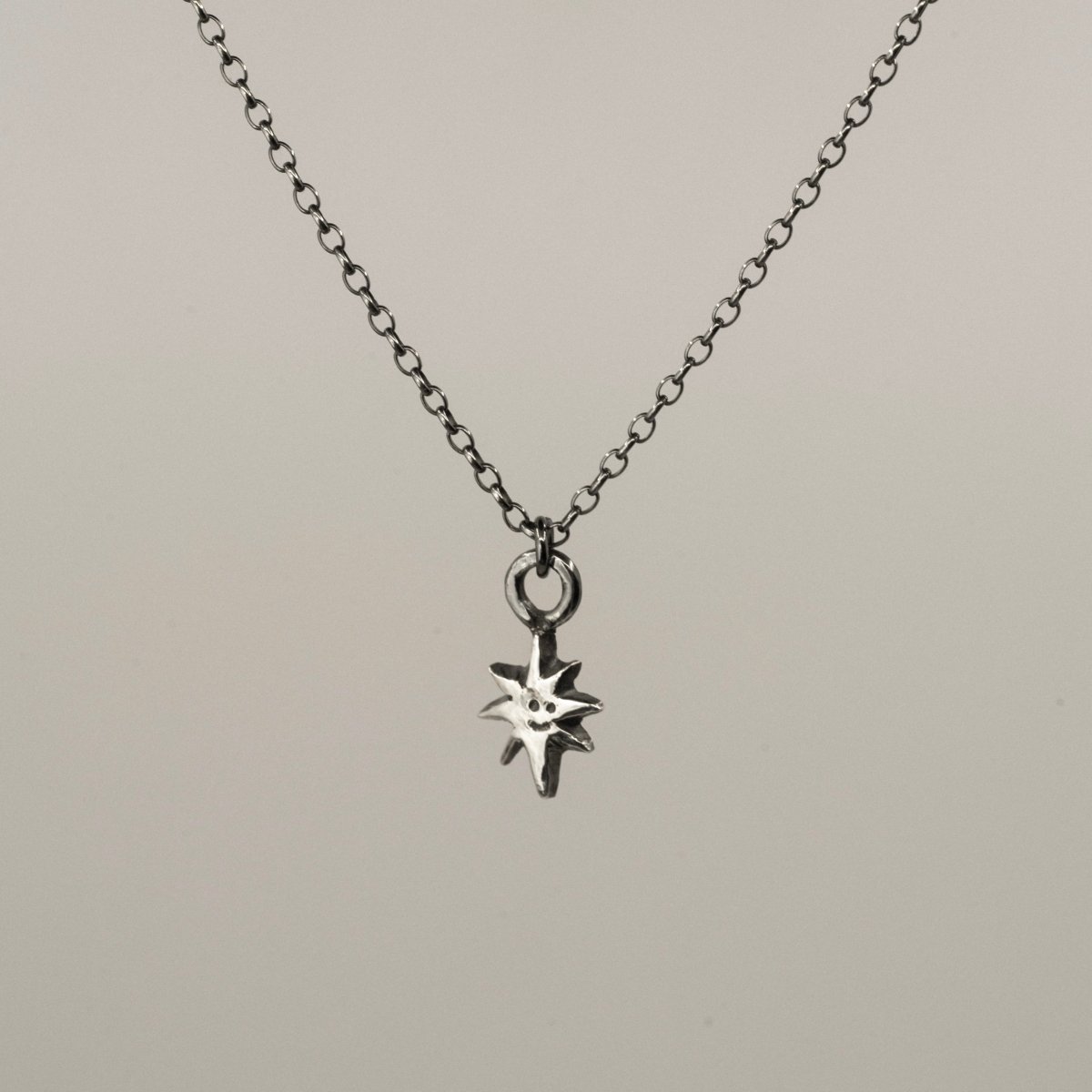 Smiling Star mini pendant - small star charm on silver chain