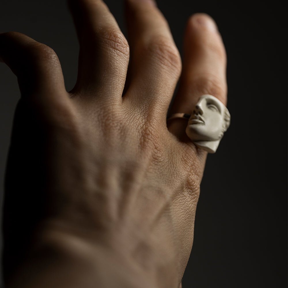 Male model wearing Achilles ring on index finger - Greek mythology ring styling shot