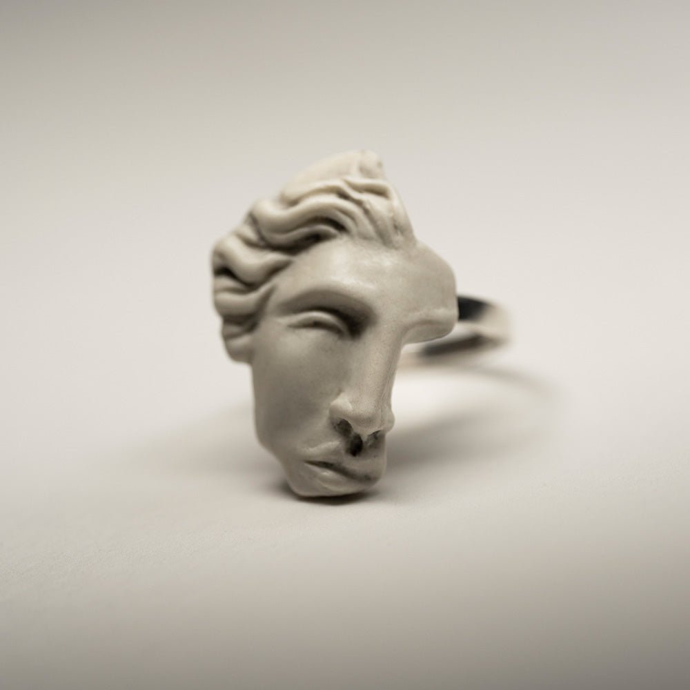 Ariadne ring - close-up of a sculptured face detail, its classical features and marble texture