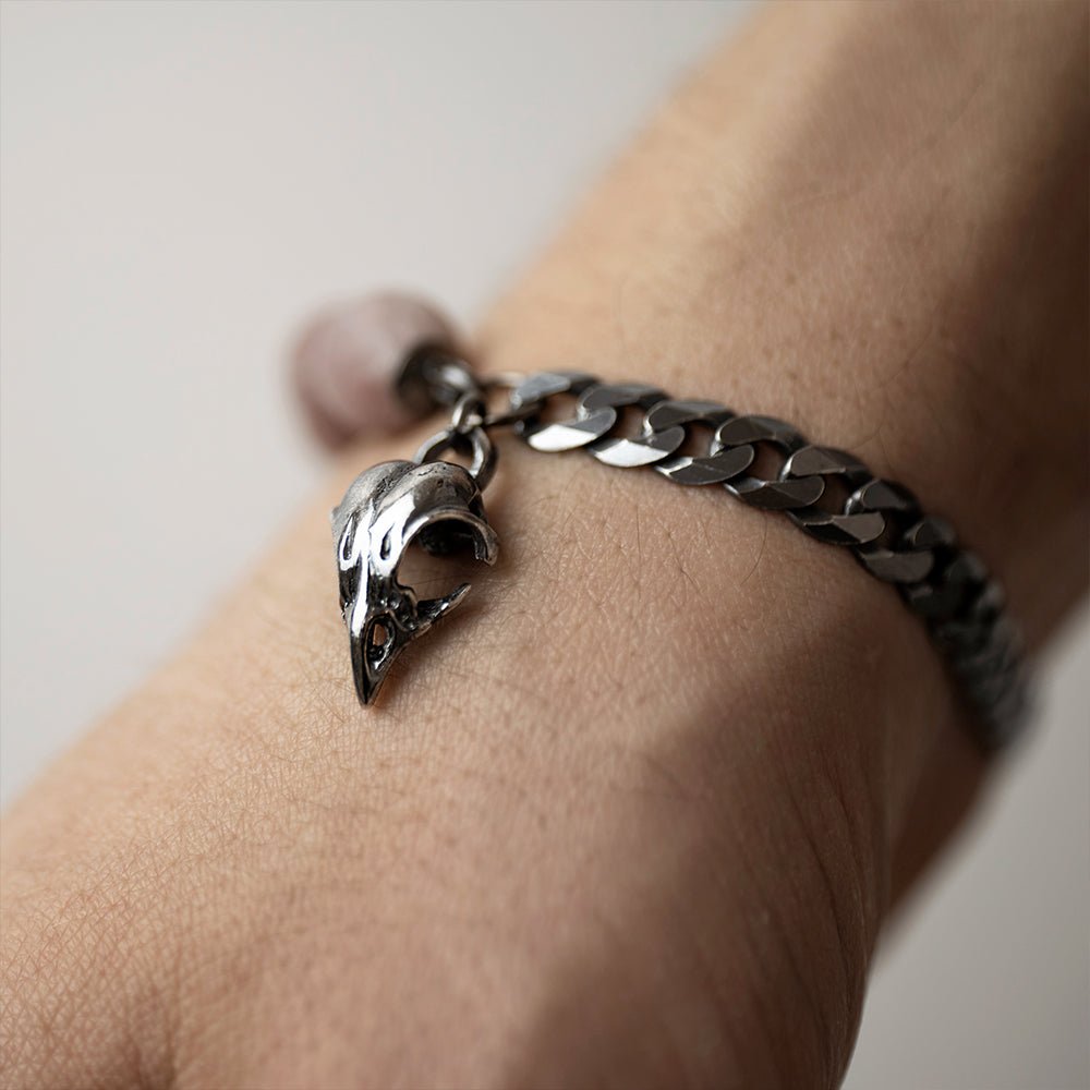 Bird Skull Bracelet on a wrist - close up of a bird skull charm