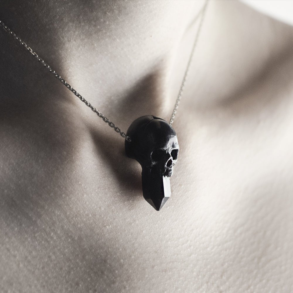 Crystal Skull pendant on a model, worn close to the neck like a chocker with skull charm