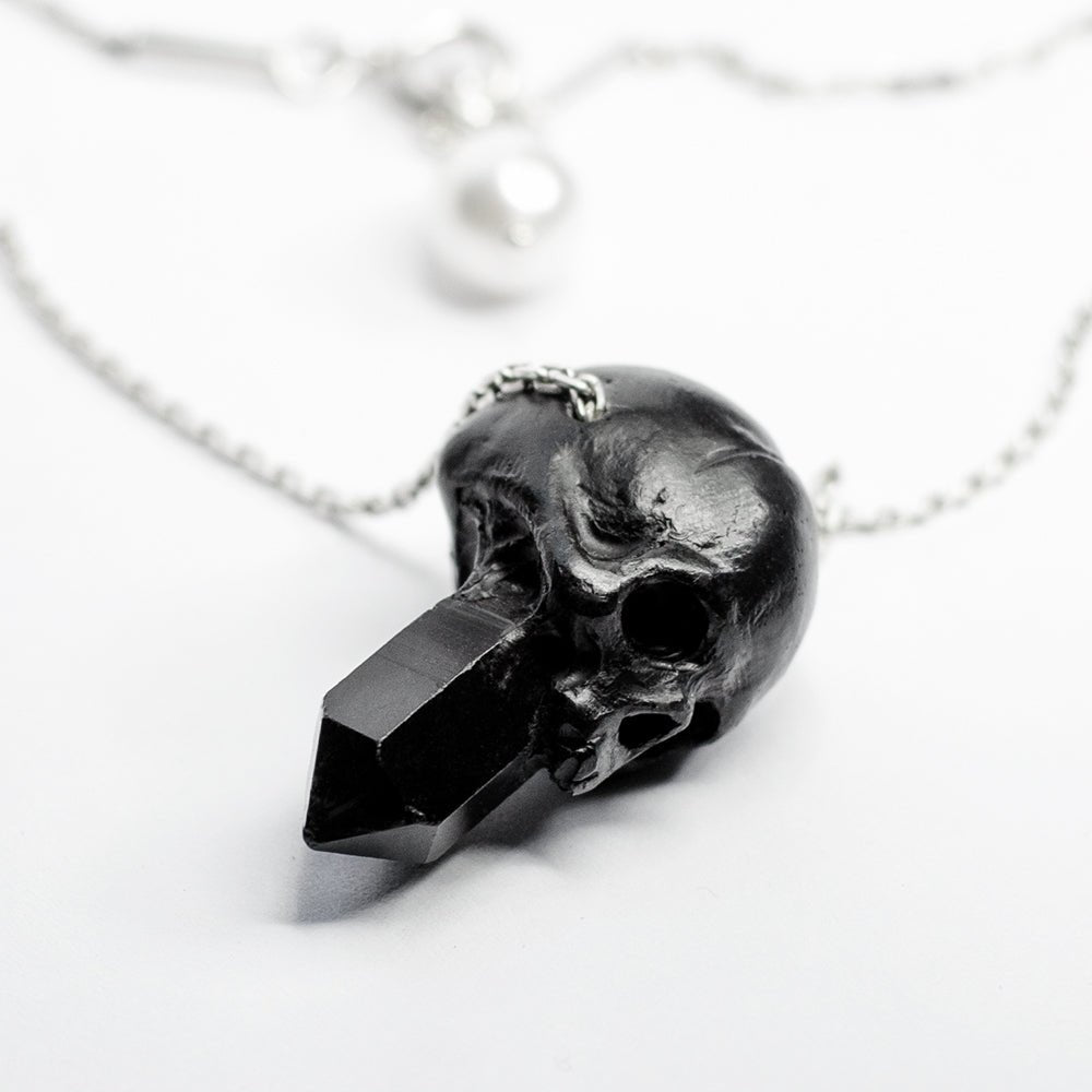 Crystal Skull pendant - small gothic marble charm in shape of a jawless skull with crystal growing out of it