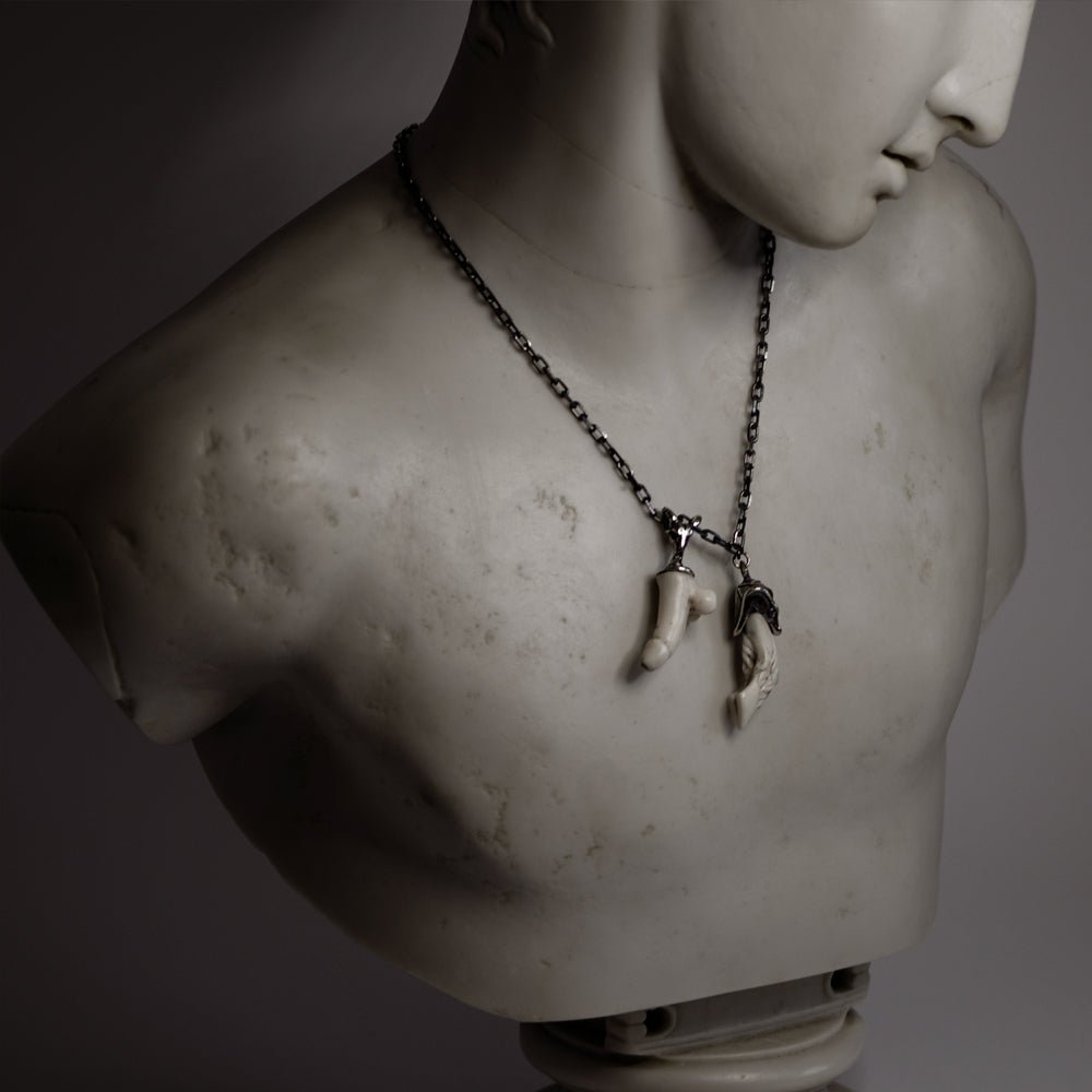 Faun pendant on marble  Ancient Greek statue - modern antiquity lifestyle shot