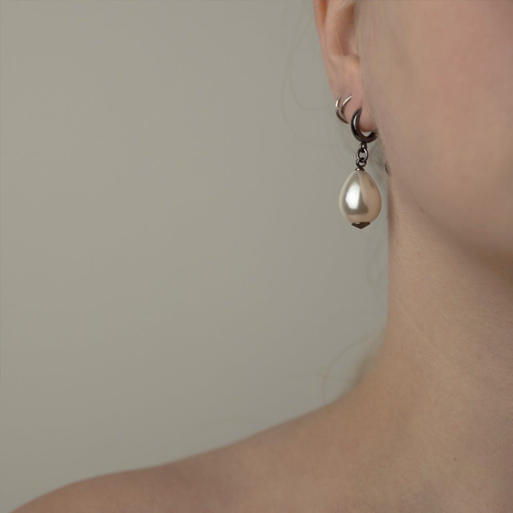 Large pearl earring - close up on a female model