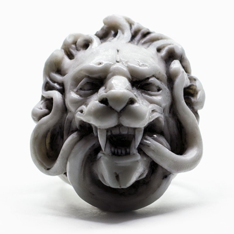 Marble Lion ring - front view - close-up of sculptured lion's head with focus on fangs and fur details