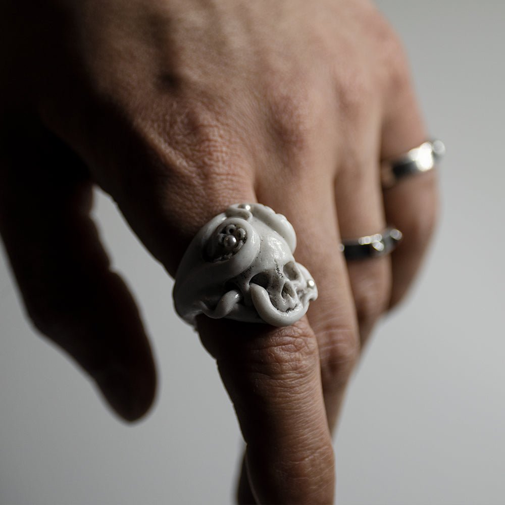 Male model wearing Octopus Skull ring with other Macabre Gadgets rings  - gothic skull styling shot