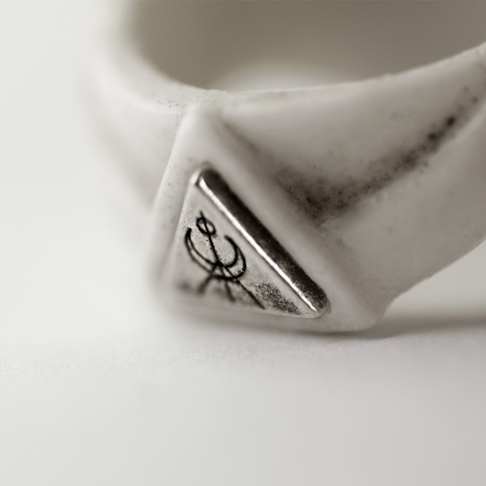 Close-up of Octopus Skull ring sterling silver logo element