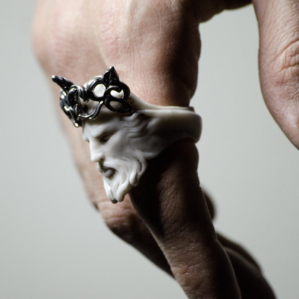 Close-up of a person's hand wearing Poseidon ring - boho style sculptured face ring
