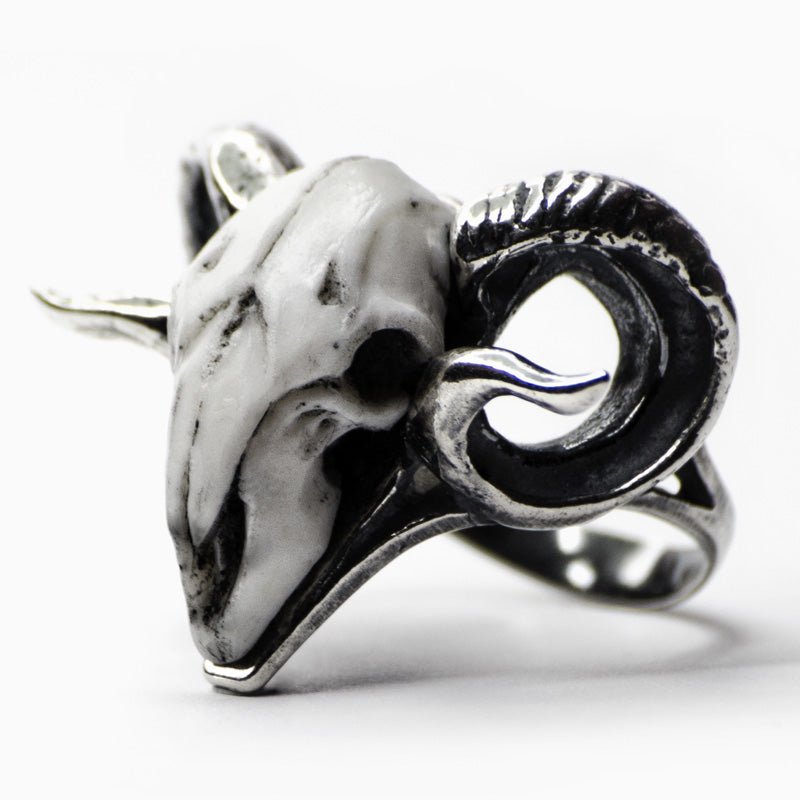 Ram Ring crafted from oxidised sterling silver (925) and bonded marble. The ring features detailed and textured design of a ram's skull and twisting horns