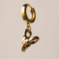 Golden Ram Skull earring by Macabre Gadgets on a white background