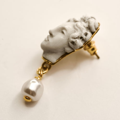 Aphrodite earring - stud statement earring with Ancient Greek sculpture face of a goddess and pearl drop on a beige background