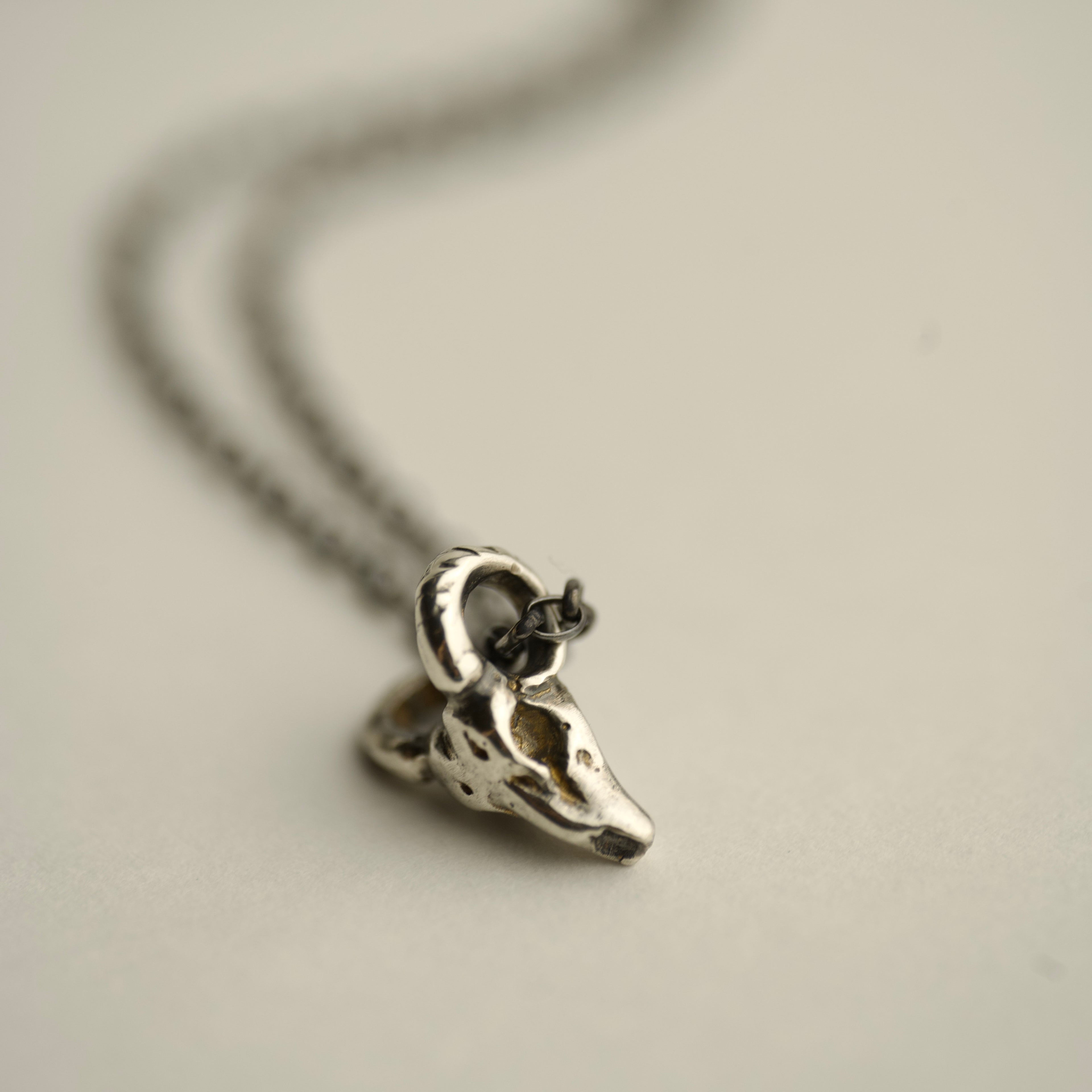 Ram Skull pendant - sterling silver mini pendant on neutral background