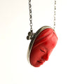 Red fmask pendant on a sterling silver chain against a white background