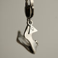 Silver Skull Jaw miniature charm handcrafted by Macabre Gadgets on a lobster lock - perfect wallet or a handbag keychain - close up on a shiny sterling silver textures