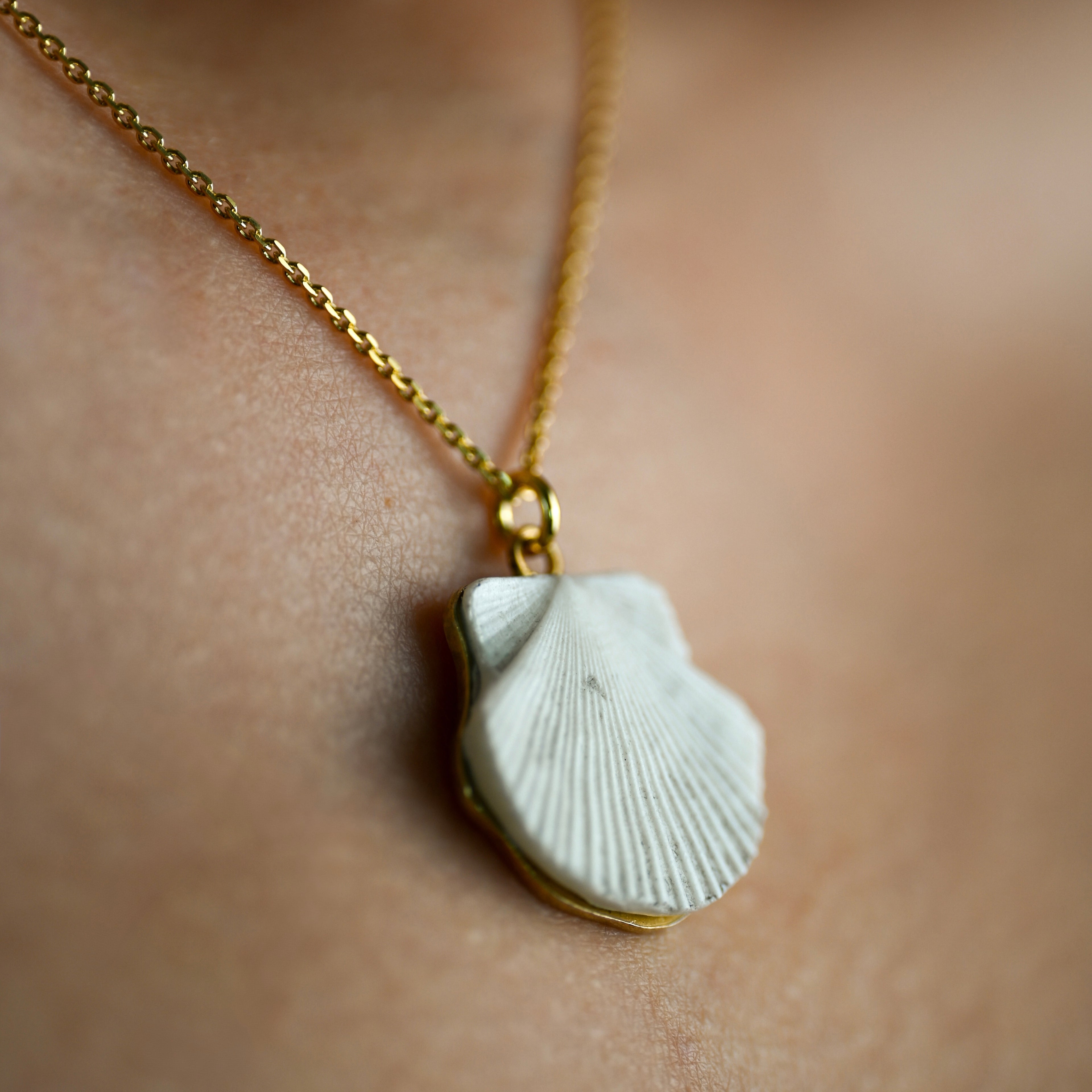 Model wearing Sea Shell pendant - close-up of marble shell necklace - mermaid inspired jewelry styling shot