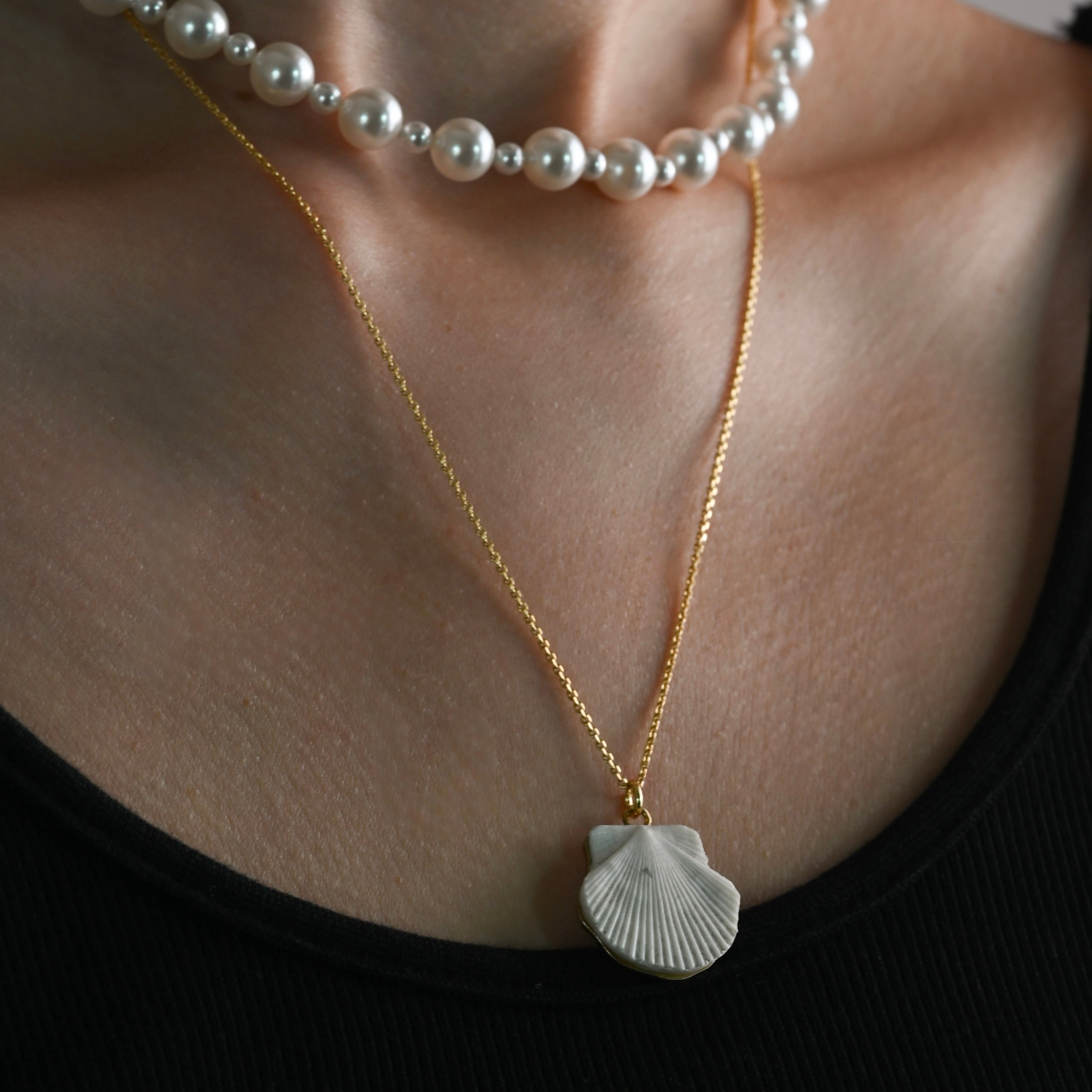 Model wearing Sea Shell pendant necklace with pearl choker - gold plated shell jewelry styling shot