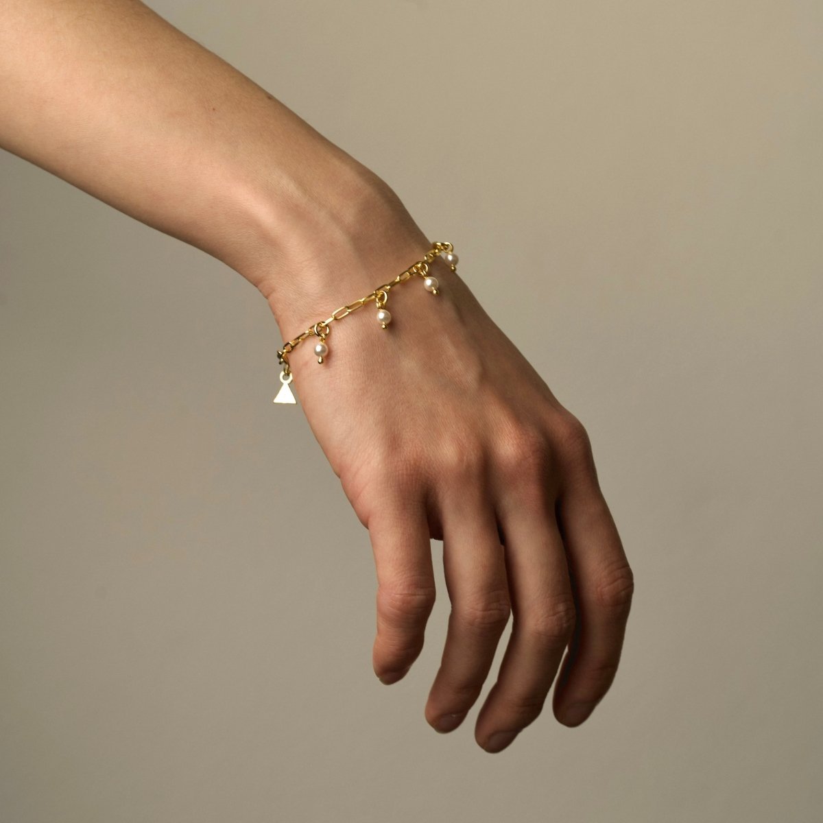 Ancient pearl bracelet on female model's hand, to show fit and dimensions