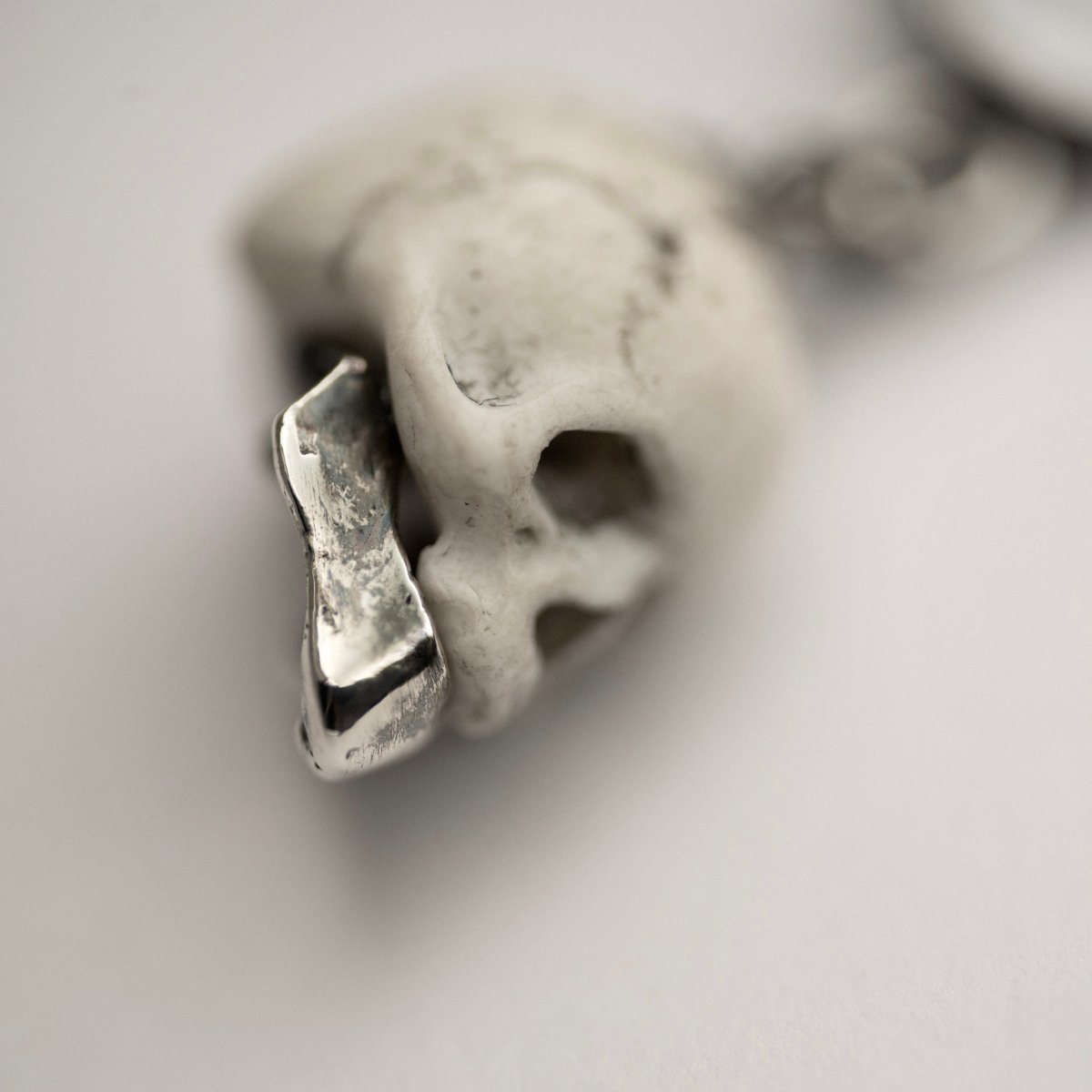 Ancient Skull earring close-up of sterling silver jaw detail