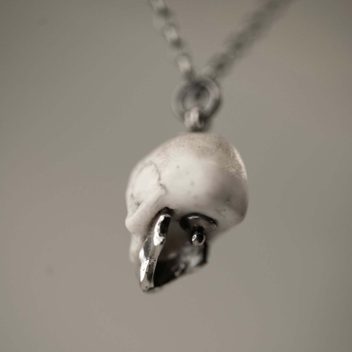 Miniature Marble Skull Pendant with Silver Jaw | Macabre Gadgets