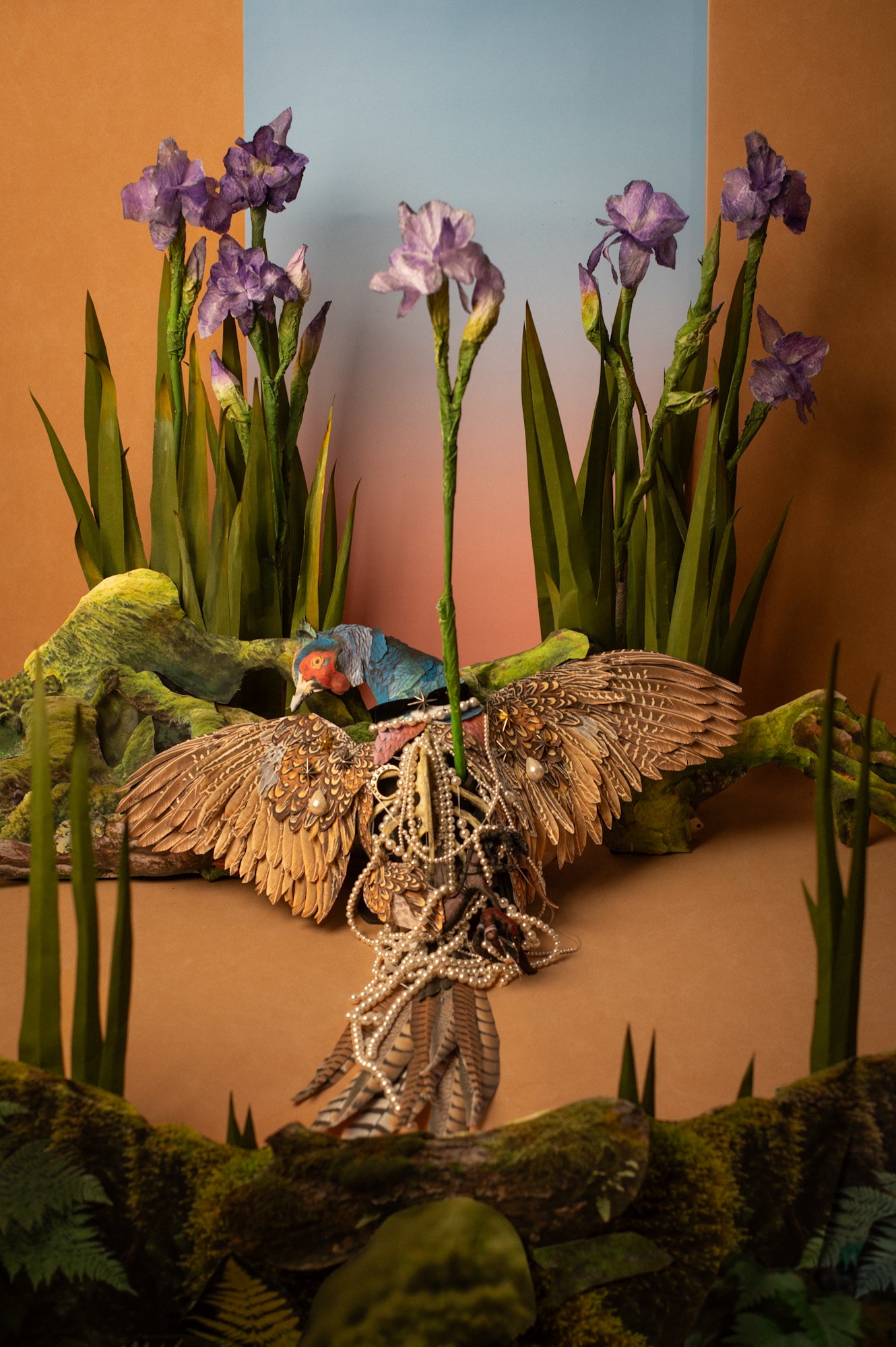 Arrow and Iris — full view of the scene with a flower growing from the bird, paper stop-motion animation by Macabre Gadgets