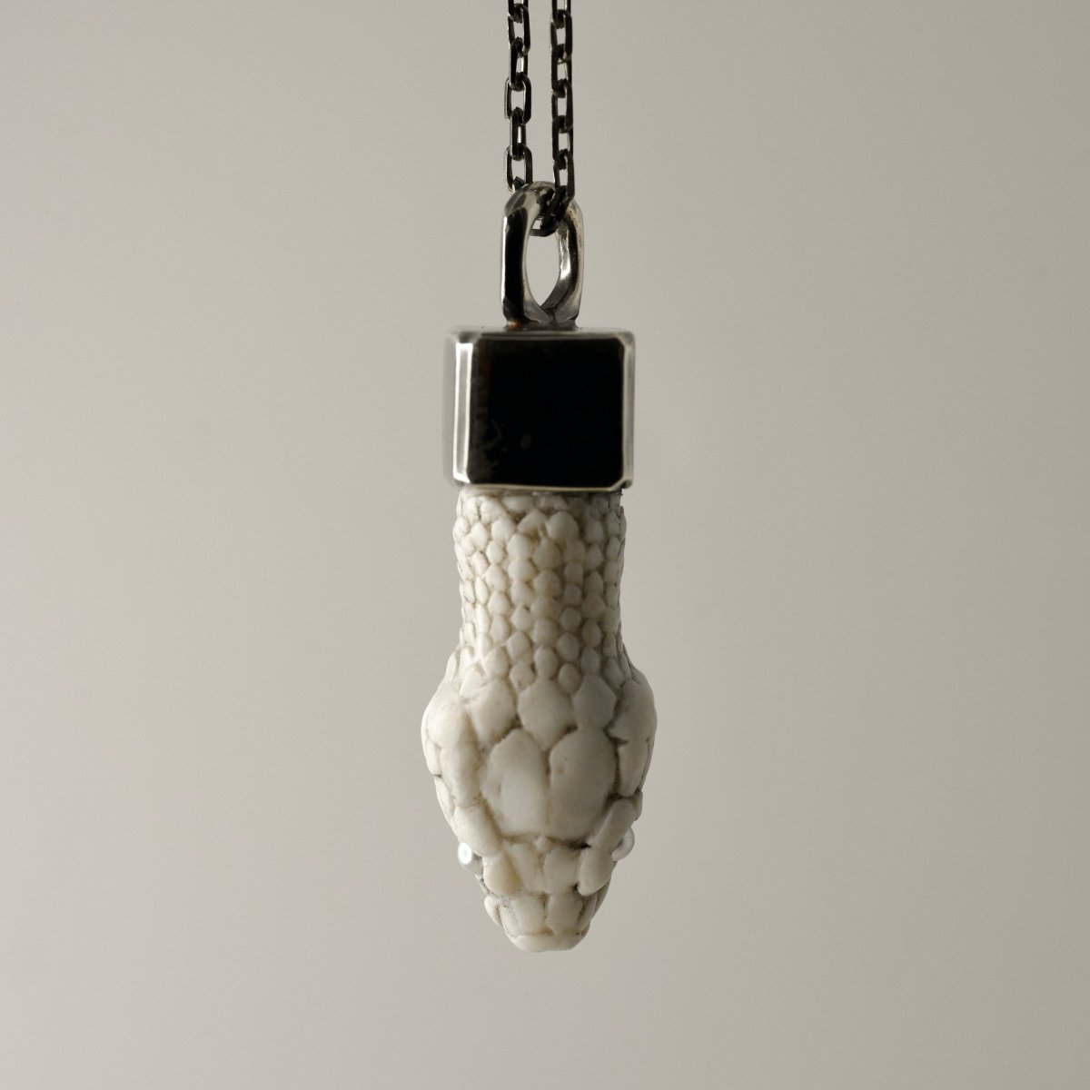 Aspis pendant - white variant, closeup