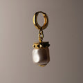 Baroque pearl earring by Macabre Gadgets - large pearl earring with gold-plated silver studs details on a huggie clasp