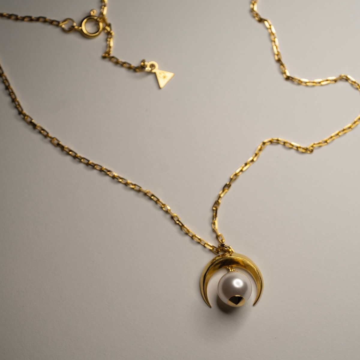Crescent Moon Pendant gold plated on eggshell surface — 18k gold celestial moon charm