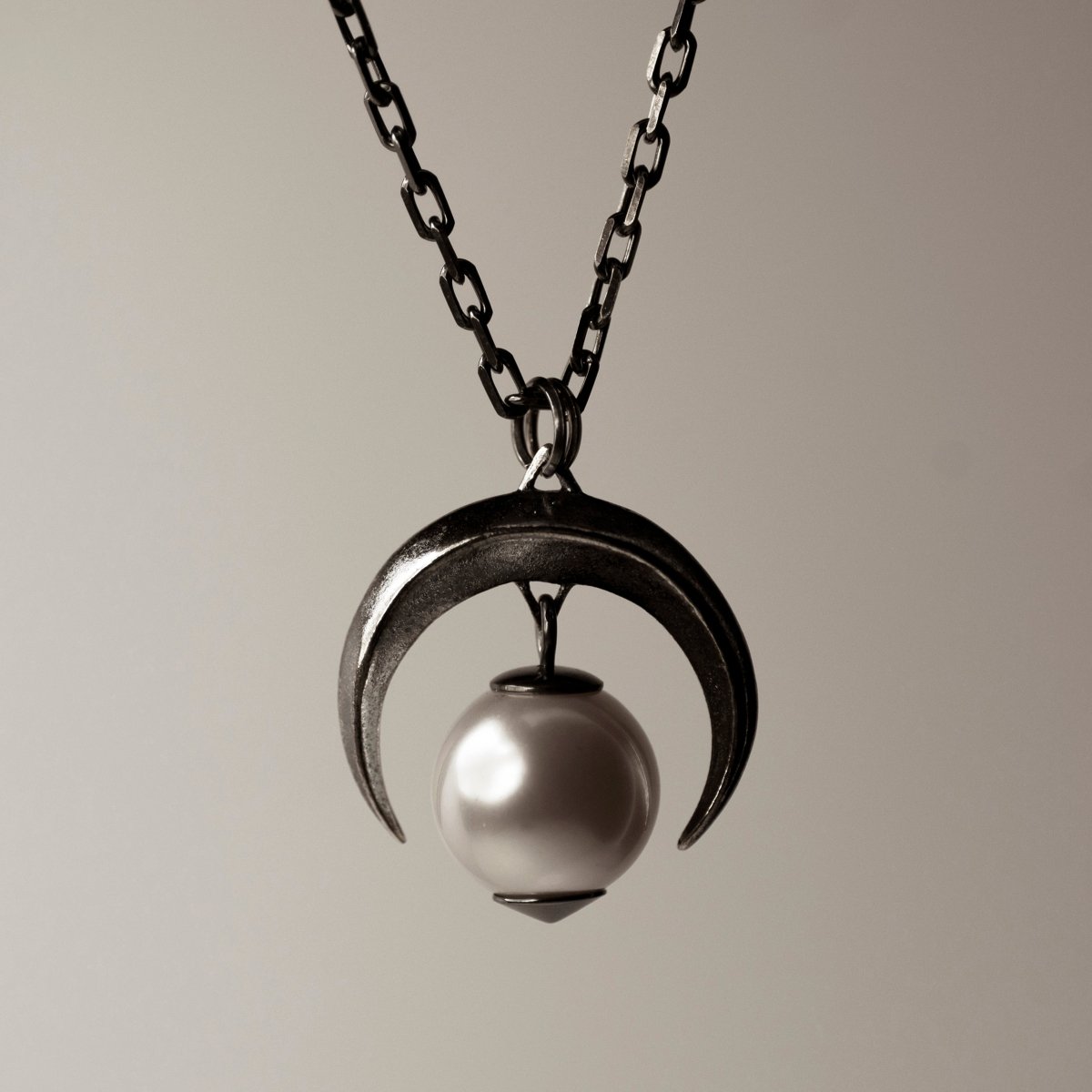 Crescent Moon Pendant in sterling silver with glass pearl — front view, celestial jewelry by Macabre Gadgets
