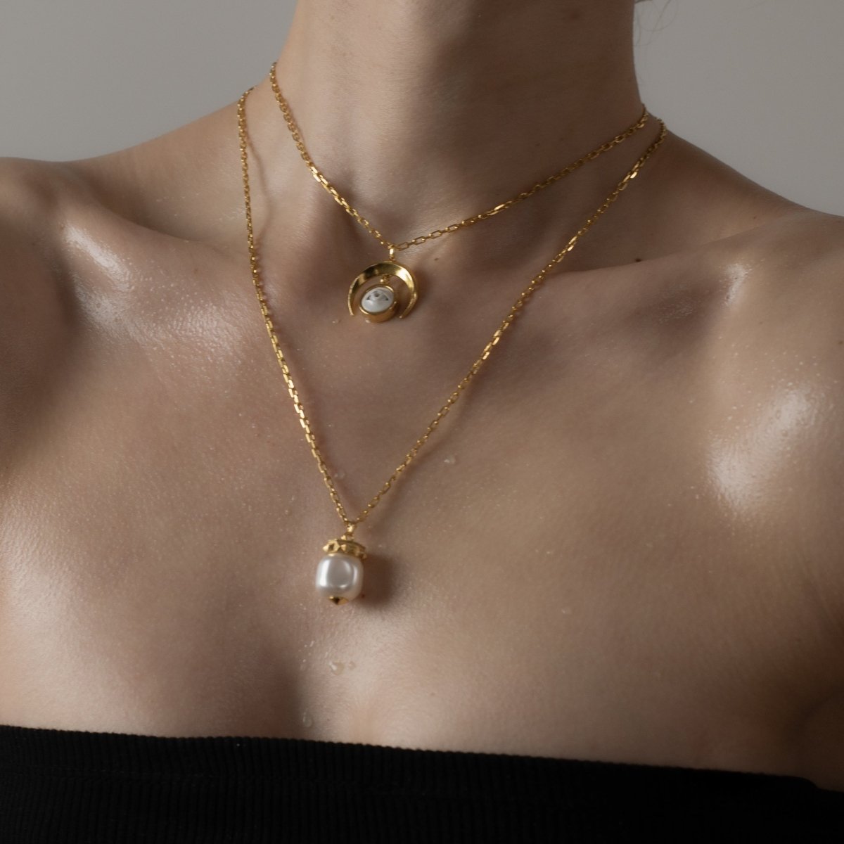 Crescent Oracle pendant - gold variant - on a female model along with other chain necklaces by Macabre Gadgets, as a part of layered necklace