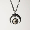 Crescent Oracle pendant - silver variant - front view against white background, focus on pendant and its fixture to the chain