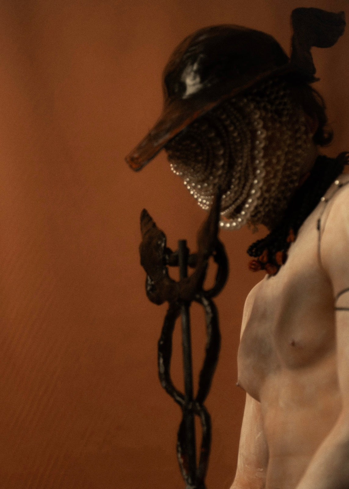 Close portrait of Hermes in pearl mask and winged helmet — the psychopomp of Ancient Greece, guide of souls to the underworld, Gods and Monsters editorial, THEA by Macabre Gadgets