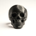 Lacquer Skull ring - frontal view on a black polished highly detailed skull, red colour is invisible from this angle