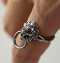 Close-up of model's hand wearing Silver Lion ring - bold modern ring with an ancient lion motif