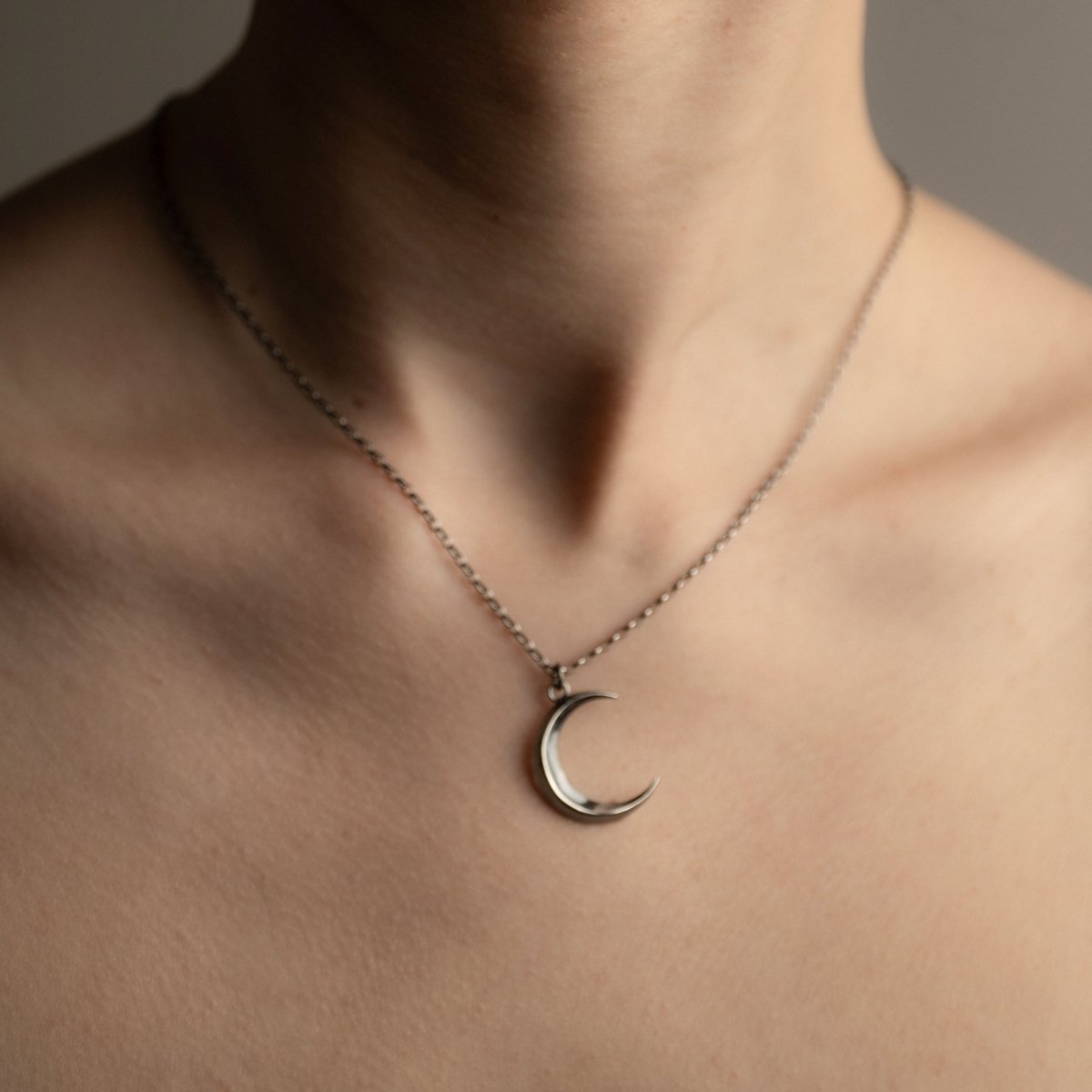 Luna pendant - silver variant - on a model, close up