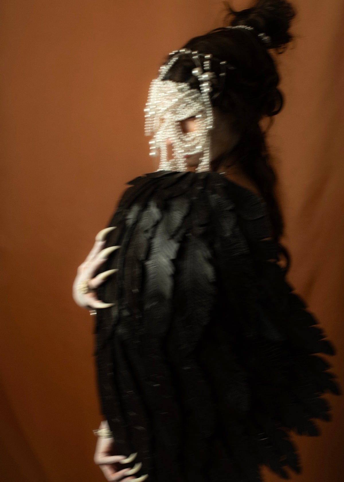 Siren portrait with a tightly knitted pearl-net mask resembling a gleaming human skull, Gods and Monsters THEA campaign | Macabre Gadgets