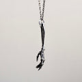 Silver Skeleton Arm pendant - general view of gothic silver pendant on white background