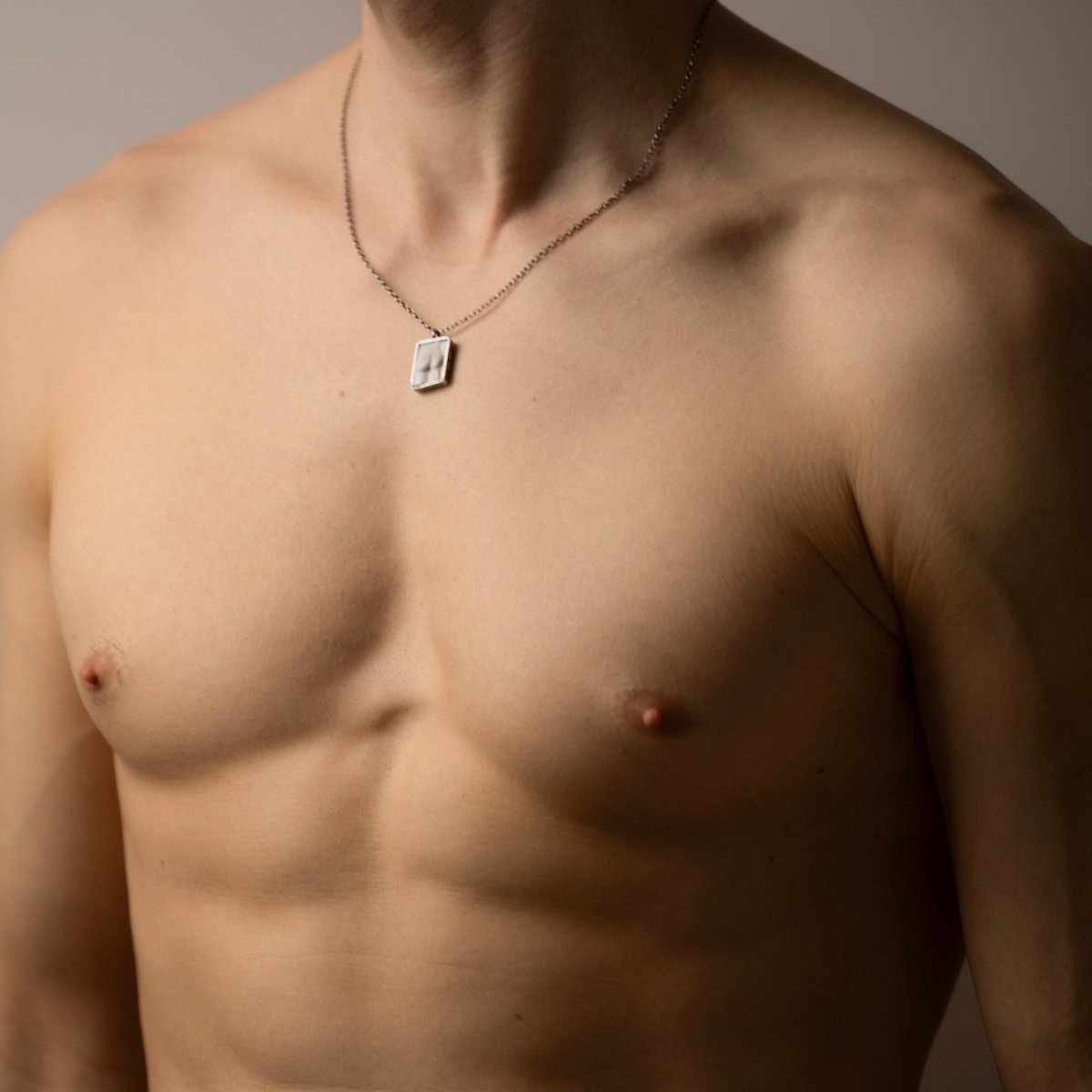 Marble Fragment pendant on a male model