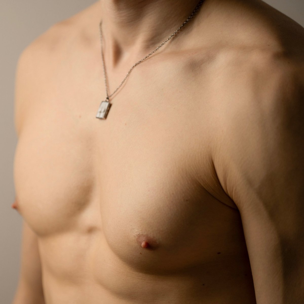 Marble Fragment pendant on a male model - close up, side view
