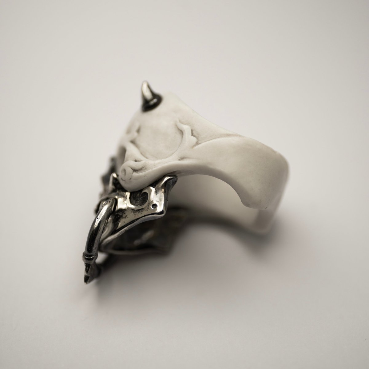 Masked Skull ring — white marble variant — semi-back view showing full sculptural form