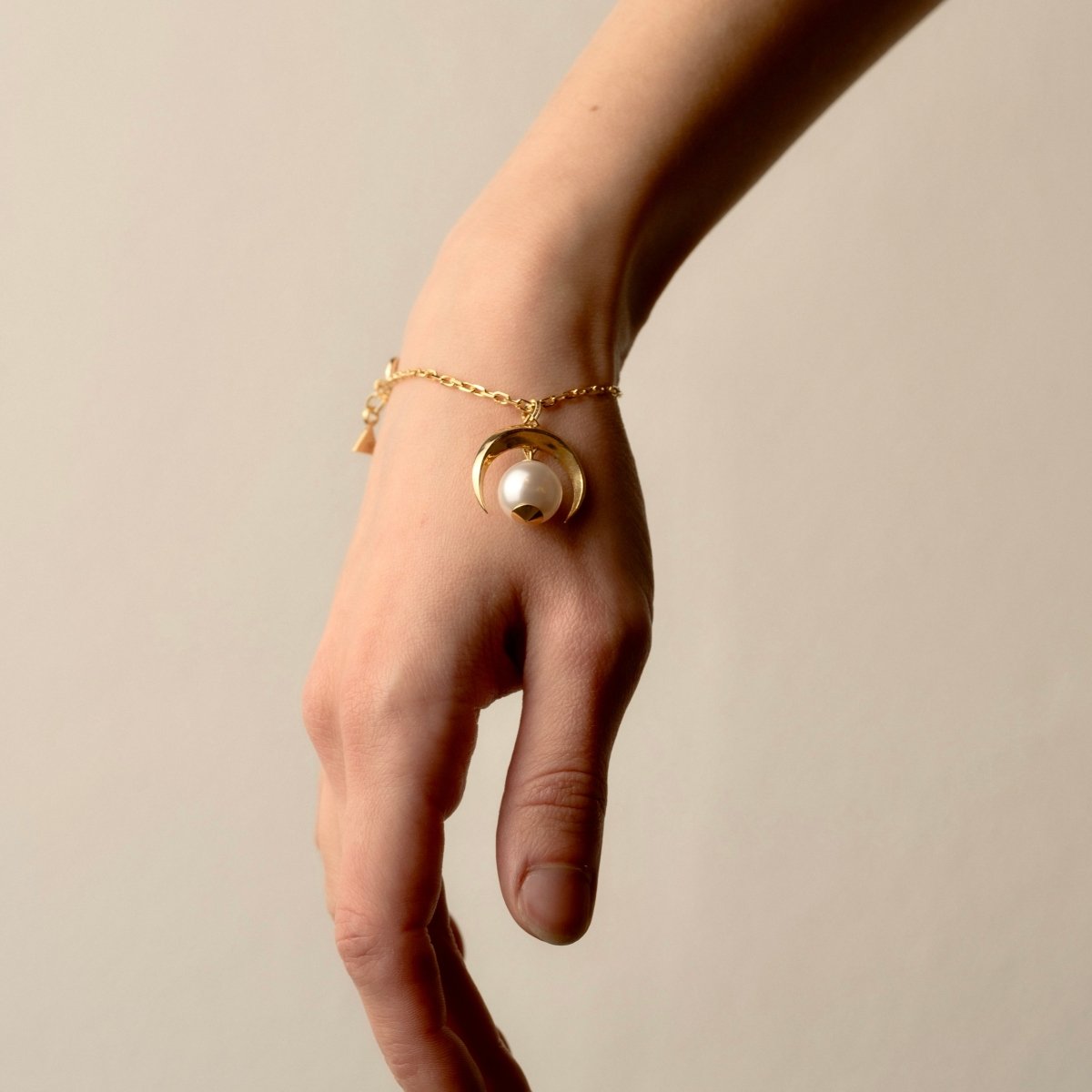 Moon bracelet on a female model's hand, to show fit and dimensions