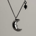 Mr. Moon pendant by Macabre Gadgets - silver pendant featuring Crescent moon symbol with a face and tiny star charm on anchor chain