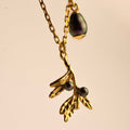 Olive Branch pendant - gold variant - front view, both olive branch charm and teardrop pearl charm are visible