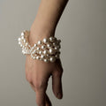 Multi-strand Pearl bracelet by Macabre Gadgets on a model's hand, shows the elegant fit of this unique piece
